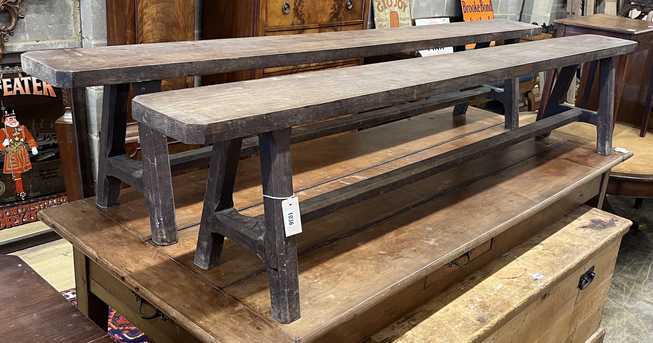 A pair of late 19th century French oak benches, length 210cm, depth 20cm, height 42cm